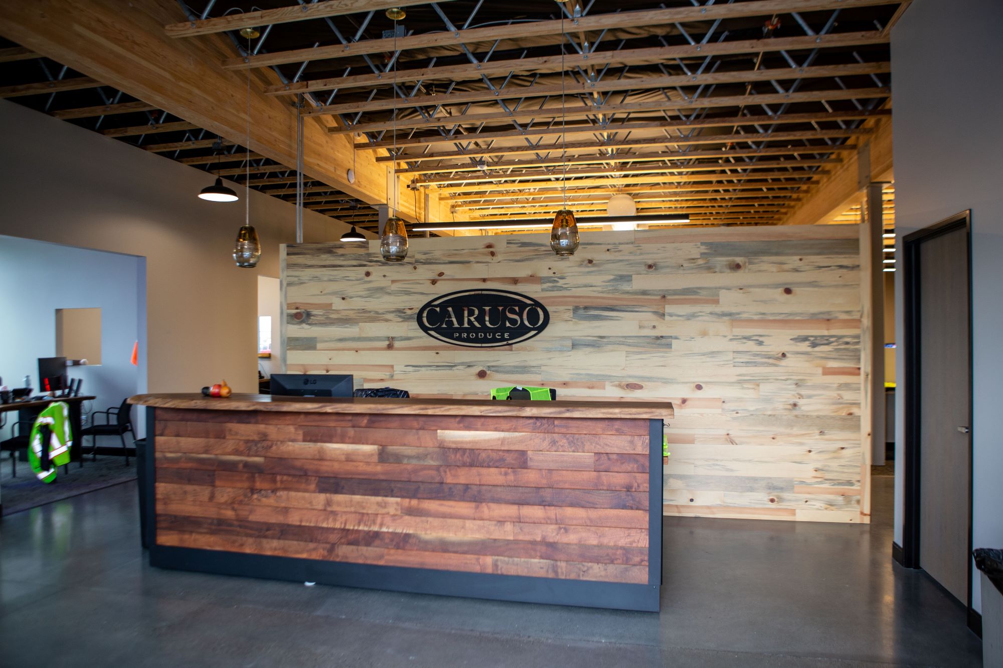 Caruso Produce photo of the front desk made of wood