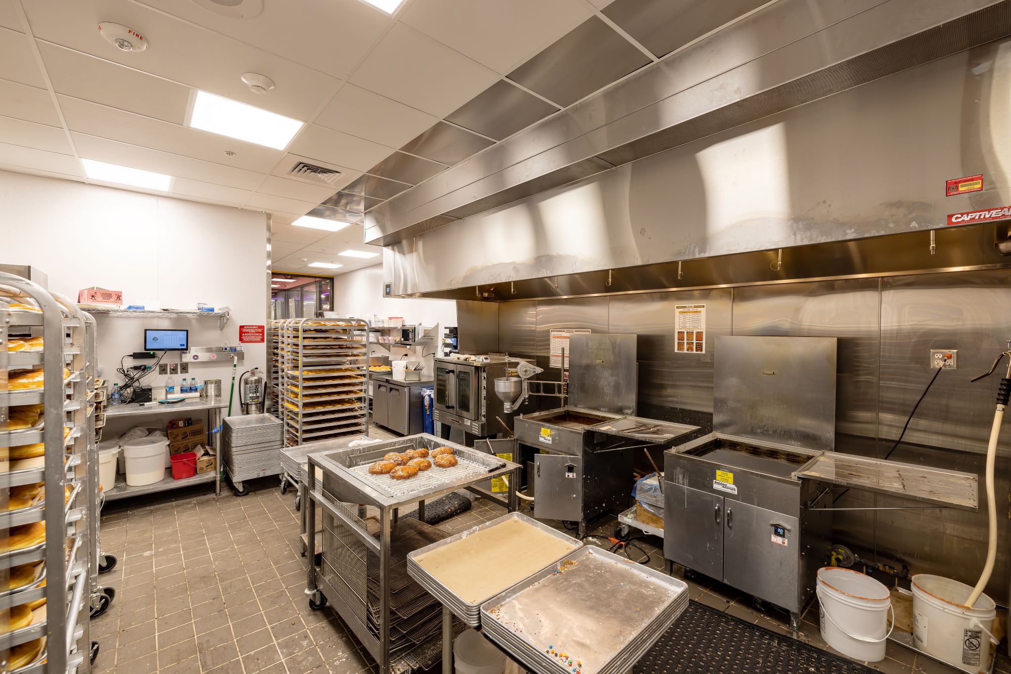 Inside the kitchen at Voodoo doughnuts